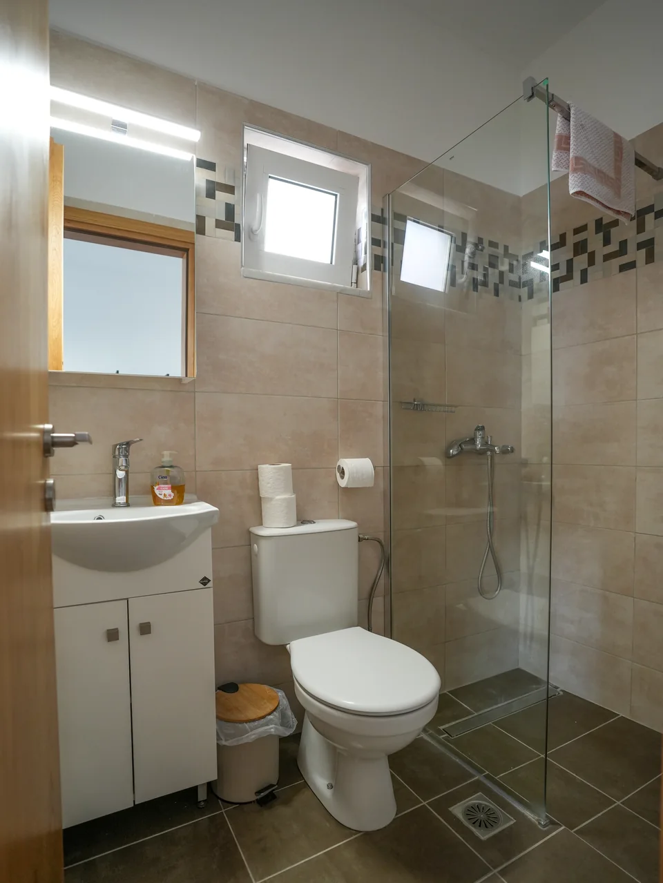 Bathroom with walk-in shower and tiled floor
