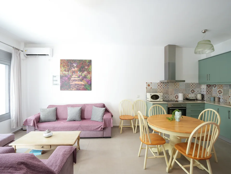 Bright open-plan living room and kitchen at Cosy, a village house in Kardamena, Kos