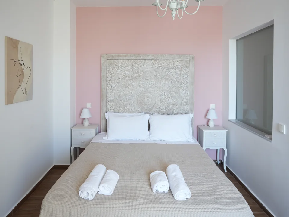 Double bed with mirror and bedside tables