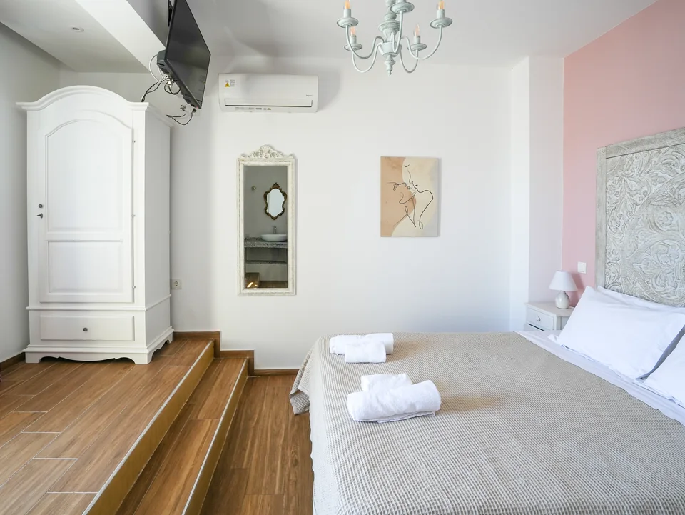 Top-floor bedroom with wardrobe and mirror