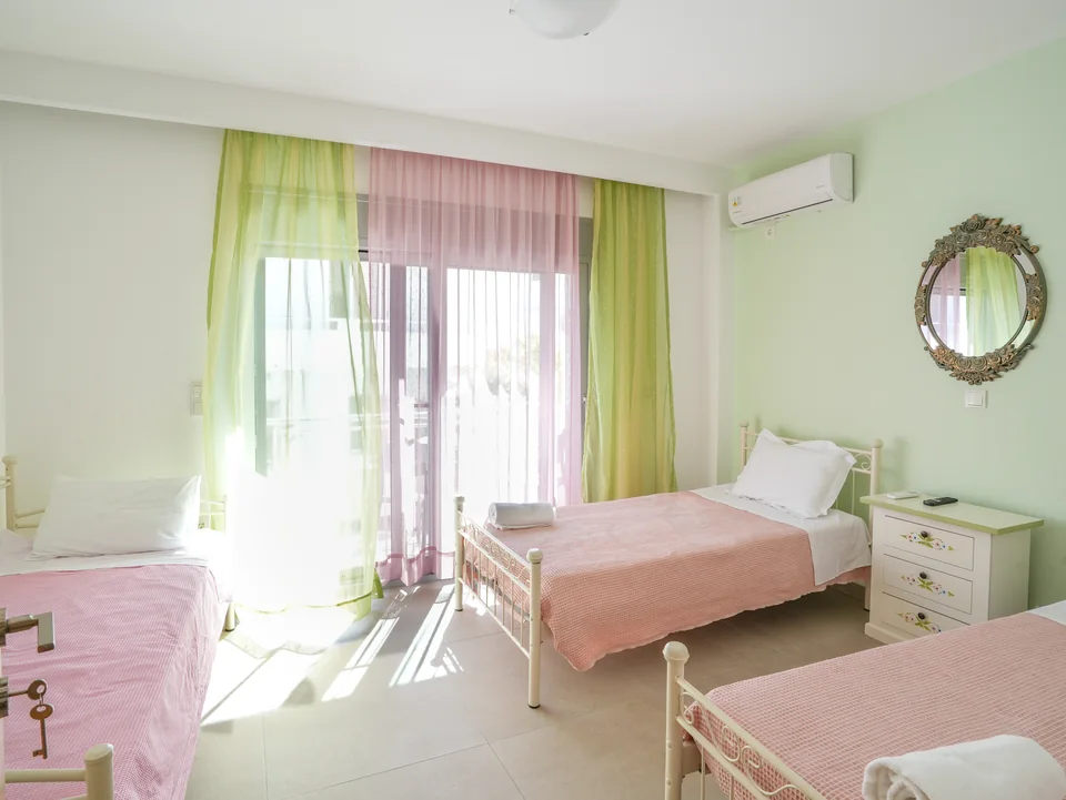 Twin beds beside the window in the morning light
