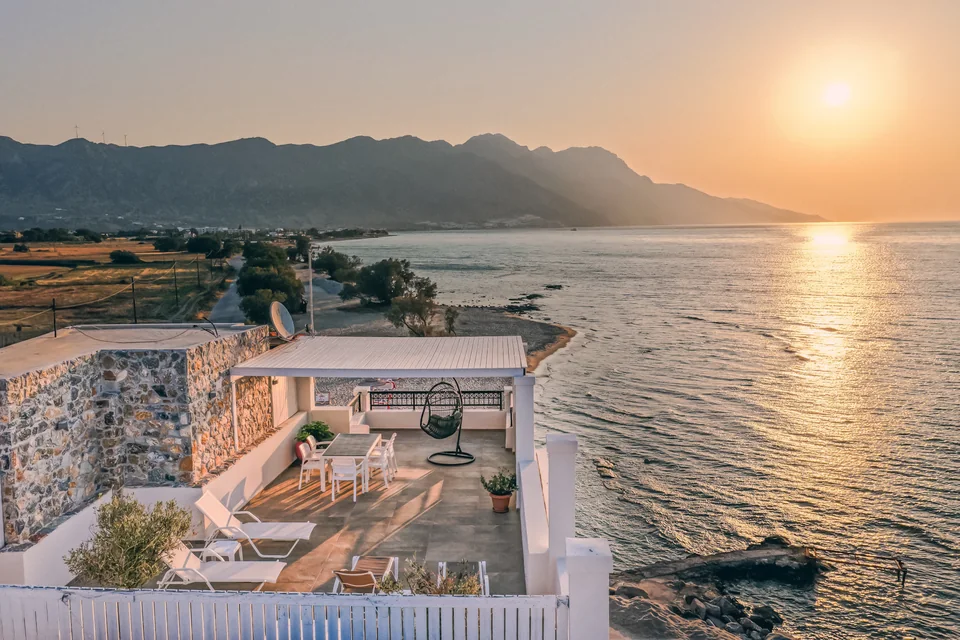 Aerial view at sunset of the Ostria View roof terrace above the sea in Kardamena, Kos