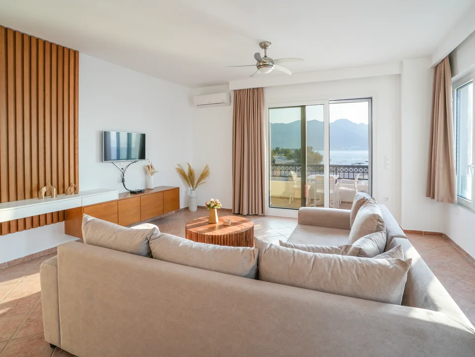 Living room sofa facing the balcony and the Aegean