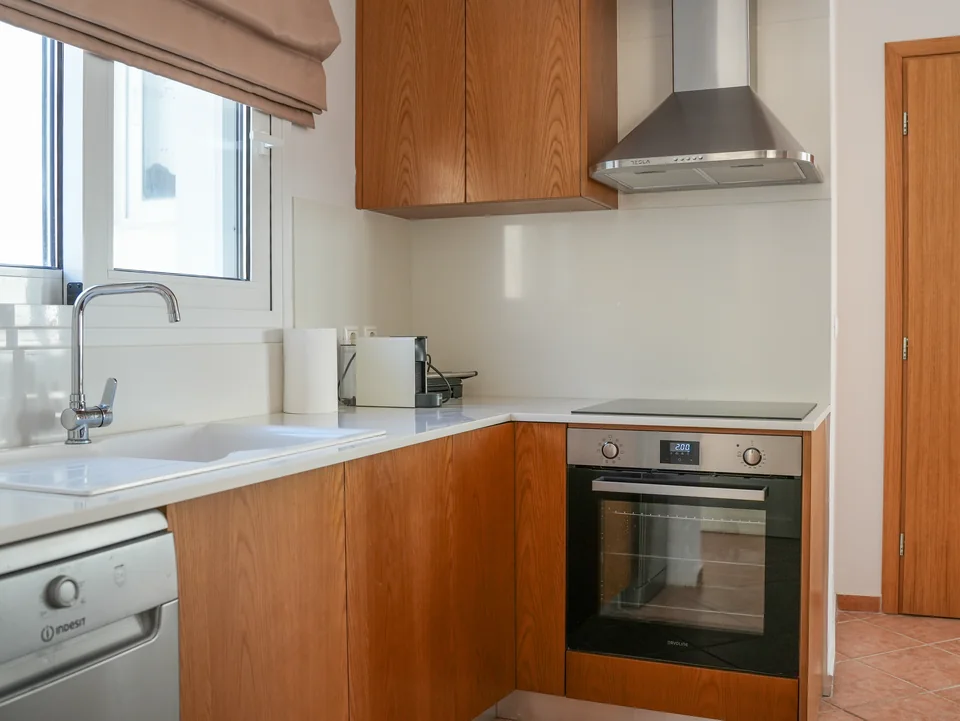Second kitchen area with oven, hob and dishwasher
