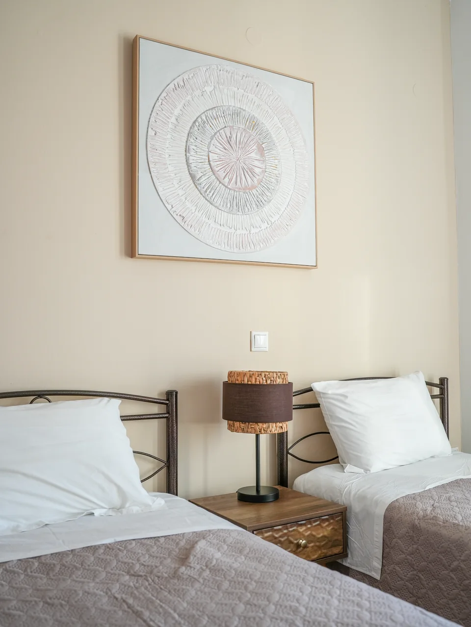 Single bed and bedside lamp in the second bedroom