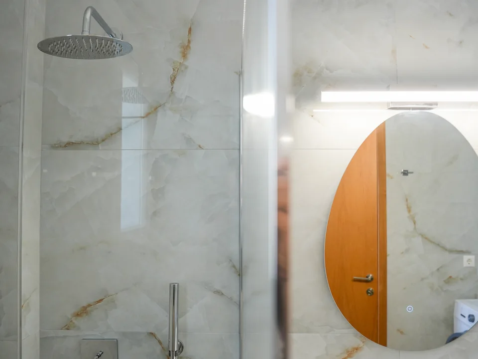 Walk-in rain shower in marble