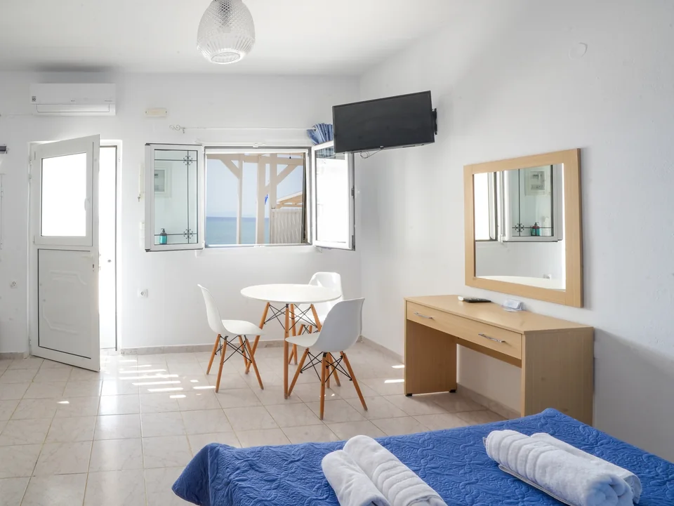 Bright studio with table, chairs and dressing table